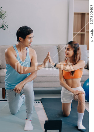 Support, teamwork and fitness couple doing workout training, challenging exercise for endurance, strength and stamina in a gym. Active, fit man and woman giving support and motivation during pushup 137890467
