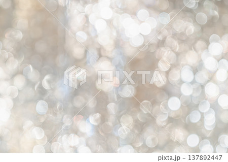 Cool toned bokeh lights with soft blur and scattered highlights forming an abstract lighting pattern that creates a calm winter mood for seasonal design use. Cool toned bokeh lights with soft blur and scattered highlights forming an abstract lighting pattern that creates a calm winter mood for seasonal design use. 137892447
