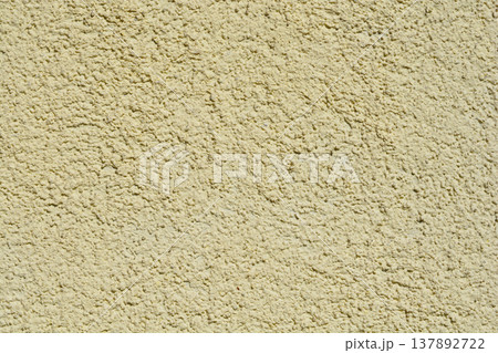 Light Yellow Textured Stucco Wall Background Light Yellow Textured Stucco Wall Background 137892722