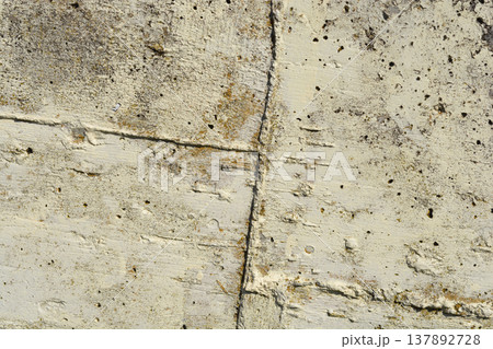 Weathered Concrete Wall with Deep Grooves Weathered Concrete Wall with Deep Grooves 137892728