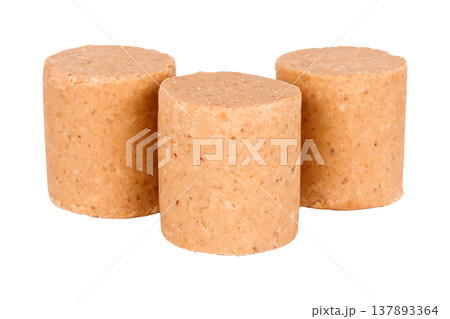 Three pacoca, a traditional Brazilian peanut candy, isolated on a white background 137893364