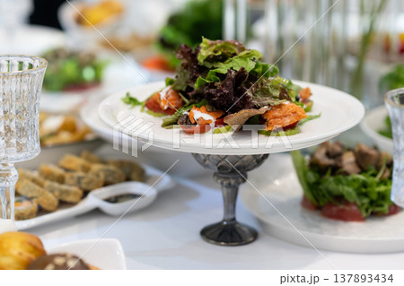 Elegant Restaurant Table Setting with Glasses and Plates. Elegant Restaurant Table Setting with Glasses and Plates. 137893434