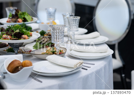 Elegant Restaurant Table Setting with Glasses and Plates. Elegant Restaurant Table Setting with Glasses and Plates. 137893470