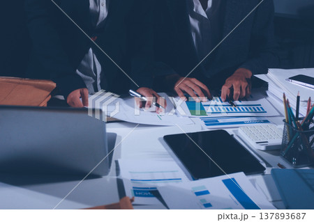 Professional photo of a person's hands reviewing a contract or legal document on a desk, for concepts of business, finance, and legal affairs Professional photo of a person's hands reviewing a contract or legal document on a desk, for concepts of business, finance, and legal affairs 137893687