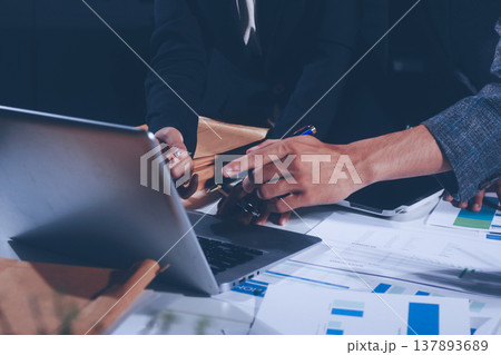 Professional photo of a person's hands reviewing a contract or legal document on a desk, for concepts of business, finance, and legal affairs Professional photo of a person's hands reviewing a contract or legal document on a desk, for concepts of business, finance, and legal affairs 137893689