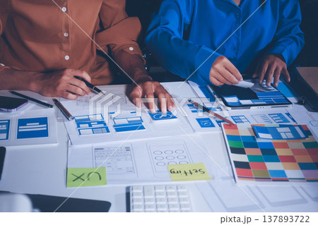 UXUI design brainstorming session with sketches and digital tools 137893722