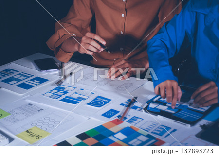 UXUI design brainstorming session with sketches and digital tools 137893723