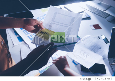 UXUI design brainstorming session with sketches and digital tools 137893761