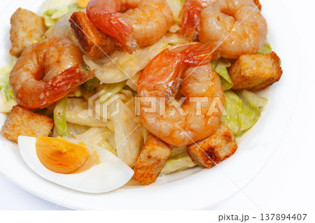 Closeup Glazed Prawn Salad Plate With Seared Edges, Golden Crouton Pieces Boiled Egg Wedges. Shallow Closeup Glazed Prawn Salad Plate With Seared Edges, Golden Crouton Pieces Boiled Egg Wedges. Shallow 137894407