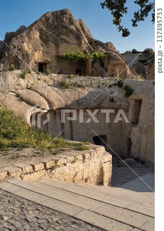 Ancient rock-cut dwellings in the stunning landscape of Goreme, Cappadocia, Turkey 137895753