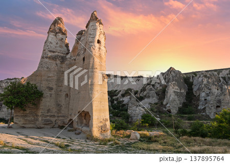 Dramatic sunset over the iconic Fairy Chimneys in Love Valley, Goreme, Cappadocia, Turkey 137895764