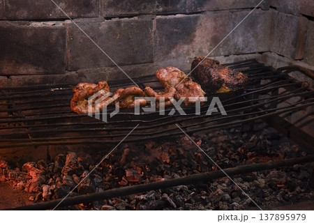 Cow bowels presented on a grill. Argentine Traditional cuisine. Cow bowels presented on a grill. Argentine Traditional cuisine. 137895979