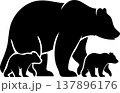 A black silhouette of a mother bear standing with her two small bear cubs, depicting a family of bears in a simple graphic style. 137896176
