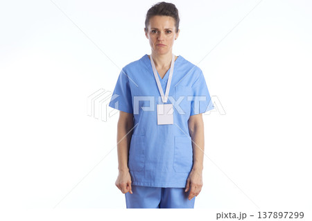 Confused Female Healthcare Professional in Blue Scrubs Confused Female Healthcare Professional in Blue Scrubs 137897299