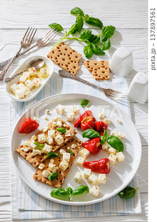 Rye crispbread open sandwich with feta and peppers Rye crispbread open sandwich with feta and peppers 137897561