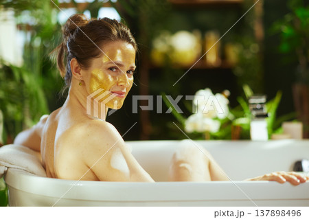 Smiling Over Shoulder: Golden Mask Bath Bliss 137898496