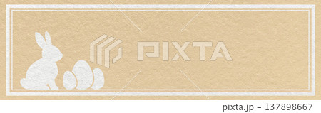 Easter website header banner with white bunny and eggs silhouette on light beige textured paper background with copy space 137898667