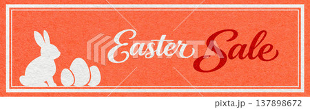 Easter sale website header banner with white bunny and eggs silhouette on warm coral textured paper background with calligraphy Easter sale website header banner with white bunny and eggs silhouette on warm coral textured paper background with calligraphy 137898672