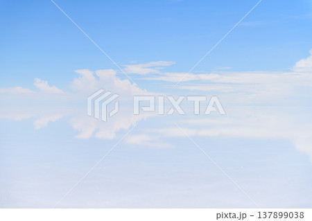 Calm blue sky with white cloud above Uyuni Salt Flat in Bolivia Calm blue sky with white cloud above Uyuni Salt Flat in Bolivia 137899038