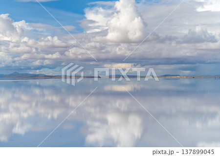 Serene mirror reflection of clouds on salt flat in uyuni bolivia 137899045