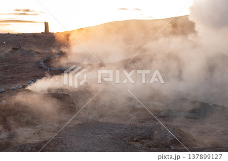 Dramatic sol de manana sunrise over geothermal geyser steam field 137899127