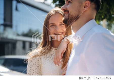 On a date, standing together. Happy couple outdoors On a date, standing together. Happy couple outdoors 137899305