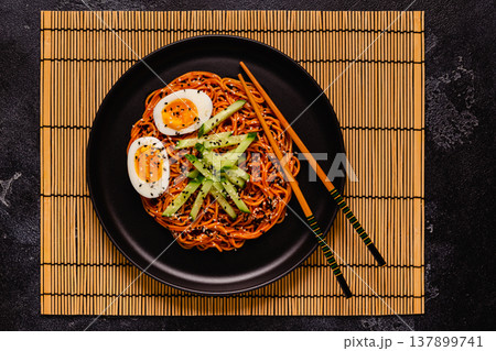 Korean traditional food, cucumber and boiled egg cold spicy noodles. 137899741