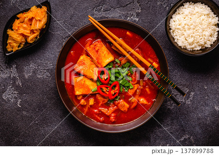 Korean traditional food, spicy kimchi soup (kimchi tige) with pork and tofu cheese. Korean traditional food, spicy kimchi soup (kimchi tige) with pork and tofu cheese. 137899788