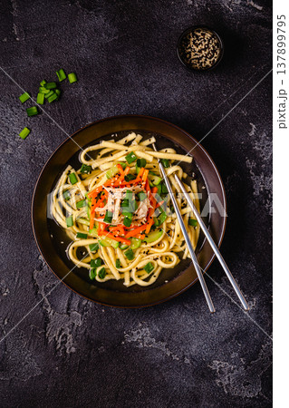 Traditional Korean chicken soup with homemade noodles 137899795