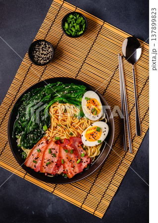 Traditional ramen noodle soup with brisket, spinach and egg. Traditional ramen noodle soup with brisket, spinach and egg. 137899823