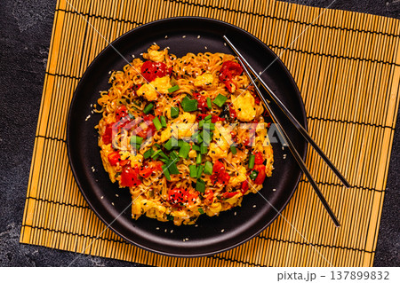 Korean style instant noodle, Shin Ramyeon with tomatoes and scrambled eggs. Korean style instant noodle, Shin Ramyeon with tomatoes and scrambled eggs. 137899832
