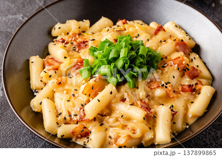Spicy Rice Cake with Cheese and Bacon or Cream Teokbokki, Tteokbokki. Spicy Rice Cake with Cheese and Bacon or Cream Teokbokki, Tteokbokki. 137899865