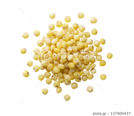 Pile of millet groats cut out on a white background. Top view Pile of millet groats cut out on a white background. Top view 137900437