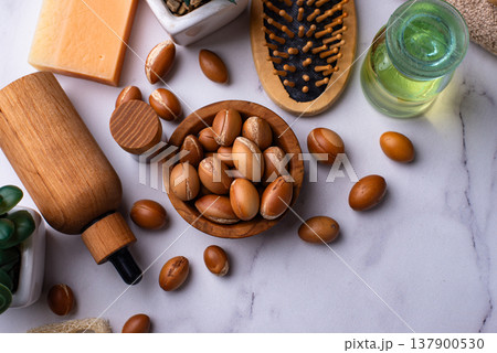 Moroccan argan seeds and oil for hair care 137900530