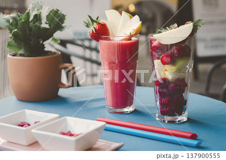 Strawbery smooties in the glass on the table 137900555