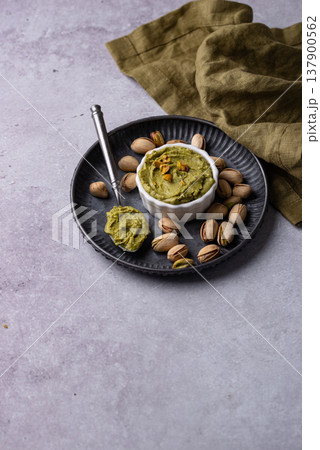 Sweet pistachio cream in a bowl Sweet pistachio cream in a bowl 137900562