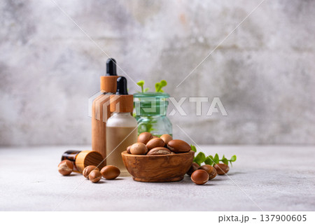Moroccan argan seeds and oil for hair care Moroccan argan seeds and oil for hair care 137900605