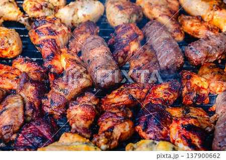 grilled meat over the coals on barbecue grilled meat over the coals on barbecue 137900662