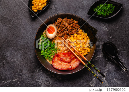 A bowl of ramen with noodles, meat and green onions. A bowl of ramen with noodles, meat and green onions. 137900692