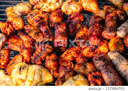grilled meat over the coals on barbecue grilled meat over the coals on barbecue 137900701