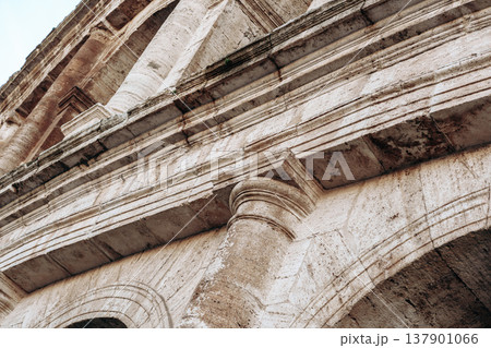 Detail of the structure showing stonework at the ancient Roman Colosseum in Italy during the day 137901066