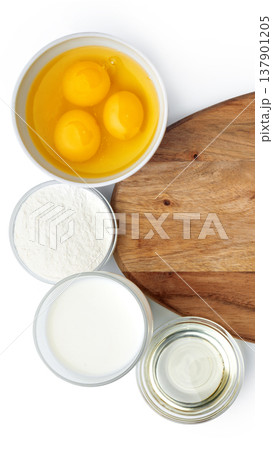 Gathering ingredients for baking with eggs, flour, milk, and oil on wooden board Gathering ingredients for baking with eggs, flour, milk, and oil on wooden board 137901205