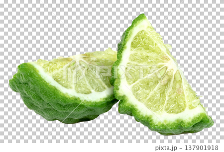Two fresh slices of green bergamot citrus fruit showing bumpy skin and juicy pulp Isolated. Perfect for food, aromatherapy, or cosmetic concepts. Clean professional macro shot. Two fresh slices of green bergamot citrus fruit showing bumpy skin and juicy pulp Isolated. Perfect for food, aromatherapy, or cosmetic concepts. Clean professional macro shot. 137901918