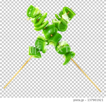 Fresh green bell pepper slices on wooden skewers arranged in an X shape isolated. Healthy vegetable kebab concept, vegan appetizer ingredients for grill or barbecue cooking. Fresh green bell pepper slices on wooden skewers arranged in an X shape isolated. Healthy vegetable kebab concept, vegan appetizer ingredients for grill or barbecue cooking. 137901921