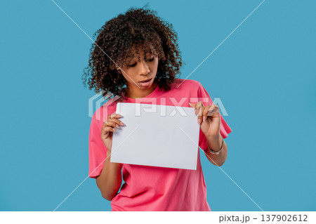 Young Sad African Woman With Blank Billboard In Hands. Copy space, Mockup Young Sad African Woman With Blank Billboard In Hands. Copy space, Mockup 137902612