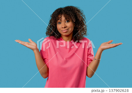 Confused African Teen Girl Shrugs Shoulders. Uncertainty, Confusion,Hesitation Confused African Teen Girl Shrugs Shoulders. Uncertainty, Confusion,Hesitation 137902628