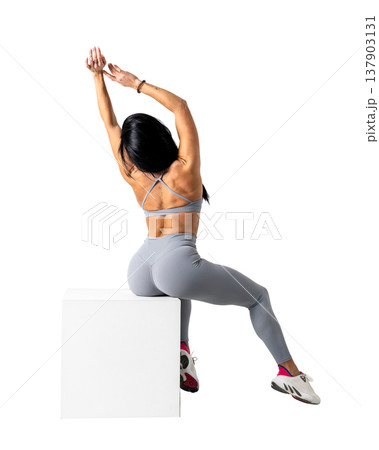 Athletic woman with a strong body wearing an activewear set on a white background Athletic woman with a strong body wearing an activewear set on a white background 137903131