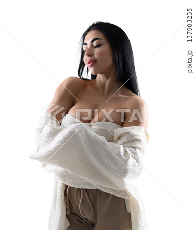 Woman posing with white shirt and brown pants on a white background 137903235