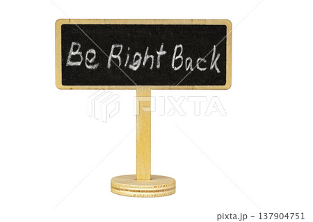 Rustic Wooden Stand with Handwritten Chalk Message Be Right Back on Isolated Black Blackboard Sign with Copy Space, Perfect for Business or Shop Absence Notice Rustic Wooden Stand with Handwritten Chalk Message Be Right Back on Isolated Black Blackboard Sign with Copy Space, Perfect for Business or Shop Absence Notice 137904751