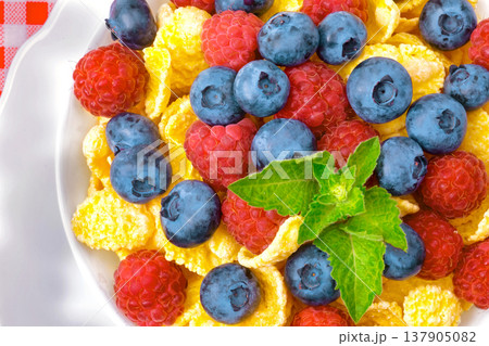 Breakfast, corn flakes with berries, raspberries, blueberries breakfast for health Breakfast, corn flakes with berries, raspberries, blueberries breakfast for health 137905082